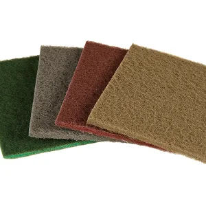 a set of four mirlon hand sanding pads in varying colors